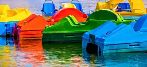 Light Green Prints: Abstract colored shot of pedal boats with reflections in water