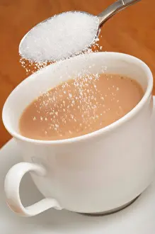 Teacup Prints: Adding white granulated sugar to cup of tea