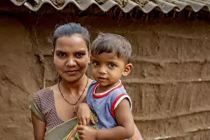 Adivasi Prints: Adivasi mother and son in a village in Narmada district, Gujarat, India