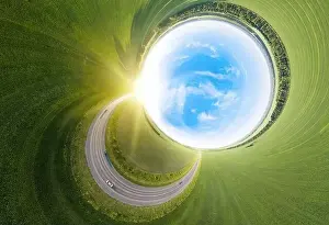 Green Road Prints: Aerial abstract 360 turned out view of a landscape while traveling by car on a circle asphalt road of a green