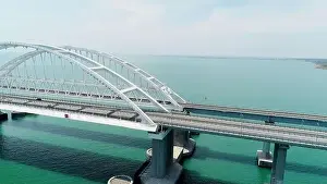 Natal Prints: Aerial breathtaking view of the turquoise sea and a long white bridge with arcuate shape
