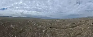 Slow Motion Prints: Aerial Cinematic slow motion shot of Drone Flying over a large herd of wild horses galloping fast across the steppe