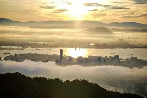 Atmospheric Mood Prints: Aerial cityscape of George Town and Penang bridge across the Penang Strait to mainland at sunrise