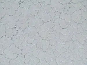 Crystallization Prints: Aerial close up of the surface of the huge salt flats Salinas Grandes de Jujuy in northern Argentina while traveling