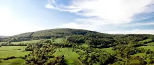 aerial drone flight over green meadows and forest in lower austria