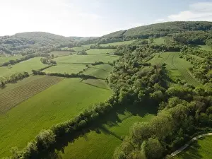 aerial drone flight over green meadows and forest in lower austria