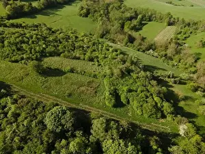 Hill Spring Prints: aerial drone flight over green meadows and forest in lower austria
