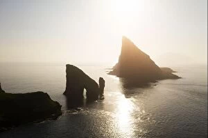 Images Dated 31st July 2019: Aerial drone flying over Drangarnir and Tindholmur sea stacks