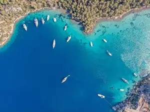 Marmaris Prints: Aerial drone footage of daily tour boats and private yachts anchored in Cennet Bay