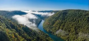 Appalachia Prints: Aerial drone image of the Cheat River flowing through narrow wooded gorge in the autumn towards Cheat Lake near