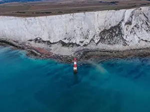 English Channel Prints: Aerial Drone Landscape photo of a Beachy Head Lighthouse and chalk cliffs at colorful sunrise with low tide in England