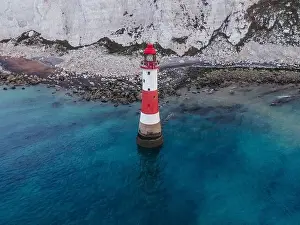 English Channel Prints: Aerial Drone Landscape photo of a Beachy Head Lighthouse and chalk cliffs at colorful sunrise with low tide in England