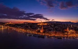 Beautiful Sky Prints: Aerial drone of lighted Matthias Church on Buda hill during Budapest sunset