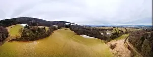 Forest Hill Prints: aerial drone panorama of green hills with a little snow in Lower Austria at the edge of the Vienna Woods near Vienna