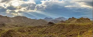 Monsoon Prints: Aerial drone panorama image of a monsoon over the Sonoran Desert of Arizona with dramatic lighting and rugged terrain