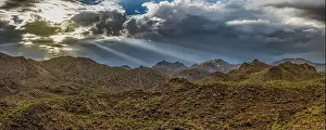 Monsoon Prints: Aerial drone panorama image of a monsoon over the Sonoran Desert of Arizona with dramatic lighting and rugged terrain