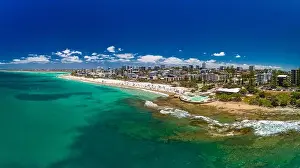 Bribie Prints: Aerial drone panoramic image of ocean waves on a busy Kings beach