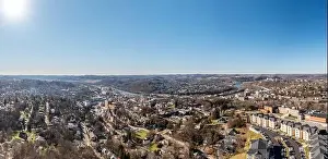 Sunburst Prints: Aerial drone panoramic shot of the downtown area of Morgantown with the WVU campus in the early winter