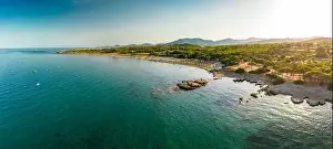 Porto Corallo Prints: Aerial drone panoramic view of Porto Tramatzu beach and the town, Sardinia, Italy