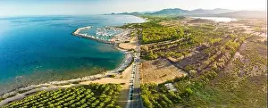 Porto Corallo Prints: Aerial drone panoramic view of Porto Tramatzu beach and the town, Sardinia, Italy