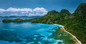 Cadlao Prints: Aerial drone panoramic view of uninhabited tropical island with rugged mountains