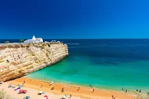 Aerial drone panoramic views of Praia Nova and Praia de Nossa beach, Algarve, Portugal