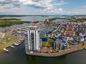 Gelderland Prints: Aerial drone photo of an apartment building that looks like a lighthouse in Harderwijk