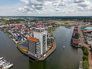 Aerial drone photo of an apartment building that looks like a lighthouse in Harderwijk, the Netherlands