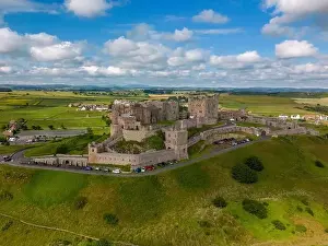English Coast Prints: Aerial drone photo of Bamburgh Castle at the beautiful coastline of Northumberland