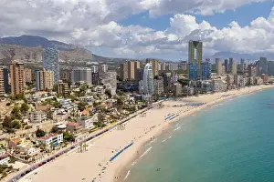 Drone Photo Prints: Aerial drone photo of the beautiful town of Benidorm in Spain showing the south beach Promenade golden sandy beach