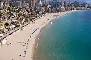 Drone Photo Prints: Aerial drone photo of the beautiful town of Benidorm in Spain showing the south beach Promenade golden sandy beach