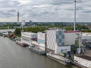Cargo Ship Prints: Aerial drone photo of a cargo barge docked at an industrial zone in Wormerveer