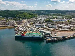 Aerial drone photo of the Ferry Terminal and a large passenger boat in Oban, Scotland