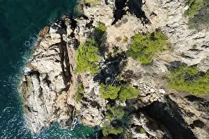Swimmers Prints: Aerial drone photo looking down on a rocky outcrop in the French Mediterranean of the Var department