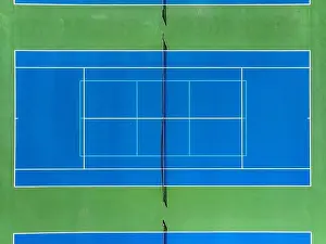 Retaining Prints: Aerial, drone, photo of new outdoor blue tennis court with white lines combined with light blue pickleball lines