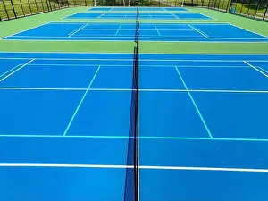Retaining Prints: Aerial, drone, photo of new outdoor blue tennis court with white lines combined with light blue pickleball lines