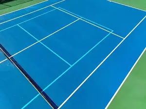 Aerial, drone, photo of new outdoor blue tennis court with white lines combined with light blue pickleball lines