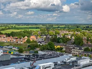 Overijssel Prints: Aerial drone photo of the old dutch windmill in the town named Olst in Overijssel