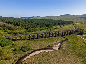 Galloway Prints: Aerial drone photo of an old railway bridge in Galloway Forest National Park in Scotland