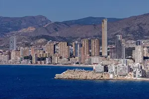 Drone Footage Prints: Aerial drone photo of the town of Benidorm in Spain in the summer time showing high rise apartments