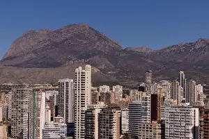 Drone Footage Prints: Aerial drone photo of the town of Benidorm in Spain in the summer time showing high rise apartments and building