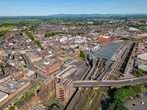 North West England Prints: An aerial drone photo of the town center of Carlisle and the large train station with railways