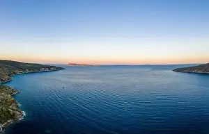 Residents Prints: Aerial drone shot of Adriatic sea Bisevo island from Komiza Vis Island view in Croatia summer before sunrise