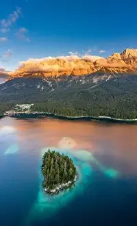 Garmisch Prints: Aerial drone shot of Alpenglow with fog on Zugspitze by Eibsee lake in Germany