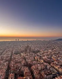 Aerial drone shot of Barcelona city before sunrise golden hour