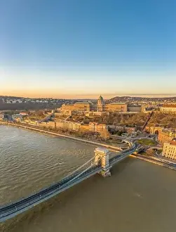 National Gallery Prints: Aerial drone shot of Buda castle on Buda hill during Budapest sunrise morning glow