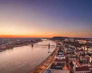 National Gallery Prints: Aerial drone shot of Buda Hill by Danube river with chain bridge before Budapest sunrise