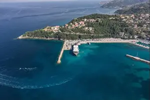 Cephalonia Prints: Aerial drone shot of cars embarking on big cruise ship at Poros town harbour of Kefalonia Island