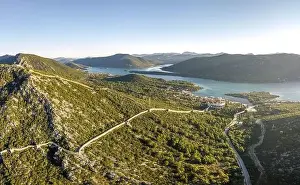 Ragusa Prints: Aerial drone shot of City Wall of Ston over hill to Mali Ston in Croatia summer morning sunrise