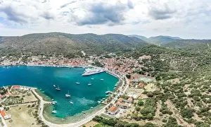 Riva Prints: Aerial drone shot of cruise ferry at Adriatic sea port on Vis Island in Croatia summer
